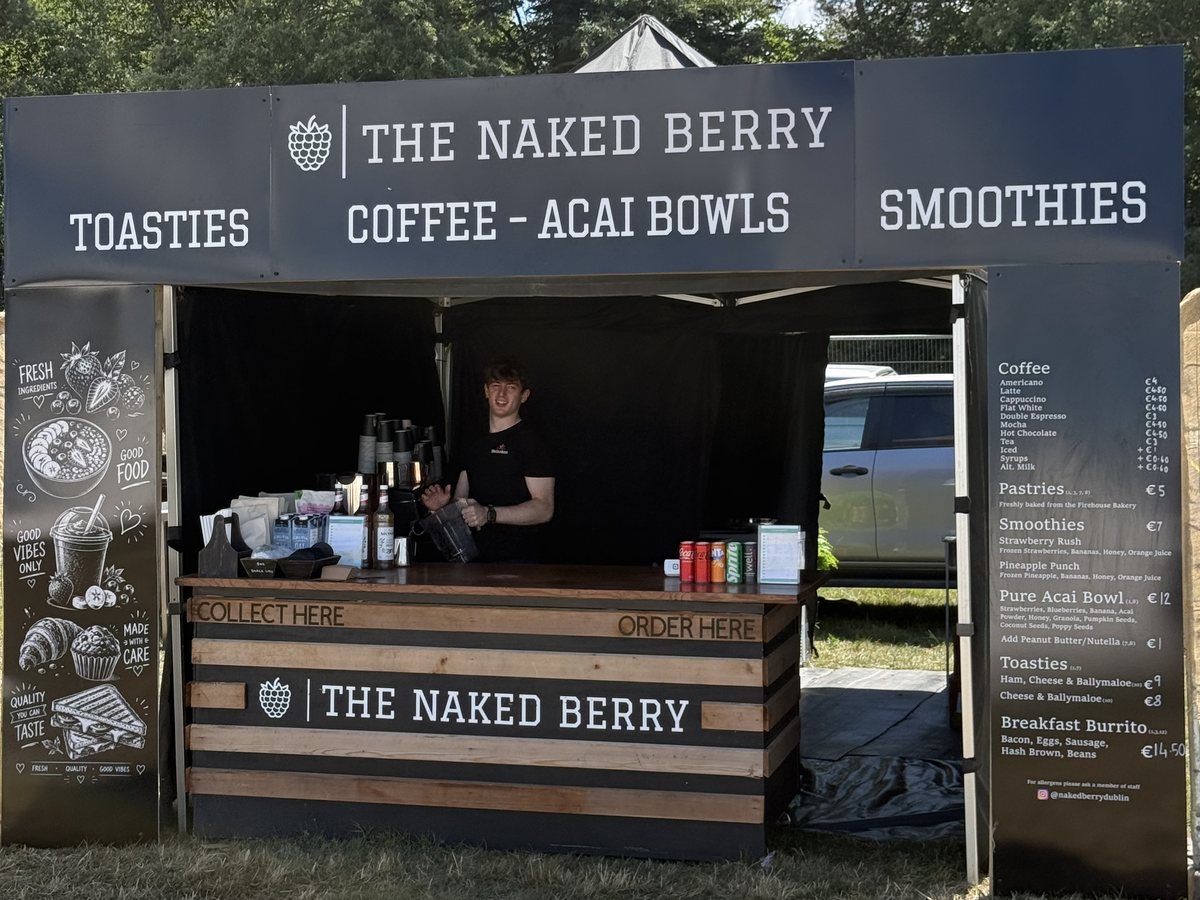 The Naked Berry Coffee Bar with strawberry cups on the counter and a drinks fridge