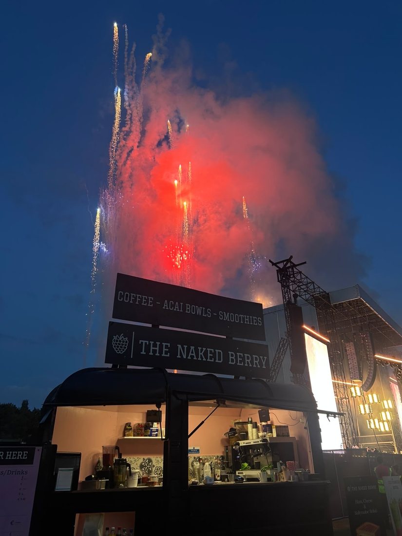 The Naked Berry Horsebox trading beside the main stage as fireworks go off