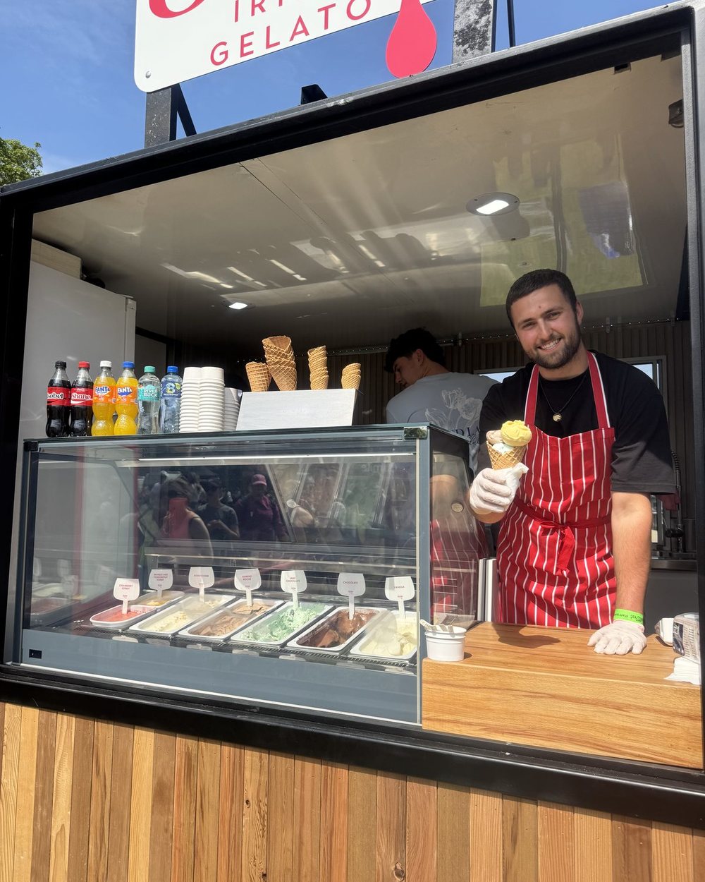 Serving Scúp gelato in a cone from the trailer’s gelato display